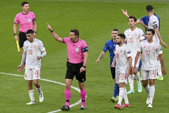 Referee Felix Brych gestures to Spain's Pedri, left, during the Euro 2020 soccer championship semifinal match between Italy and Spain at Wembley stadium in London, Tuesday, July 6, 2021. (Facundo ...