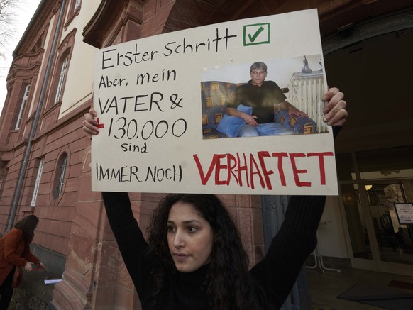 FILE - Serda Alshehabi comments on the verdict in front of the building of the Higher Regional Court in Koblenz, Germany, Feb. 24, 2021. The court in the German city of Koblenz is scheduled to deliver ...
