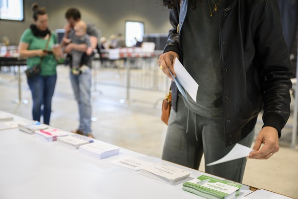 French people living in Switzerland casts his ballot during the first round of French legislative elections at the polling station &quot;Palais de Beaulieu&quot; in Lausanne, Switzerland, Sunday, June ...