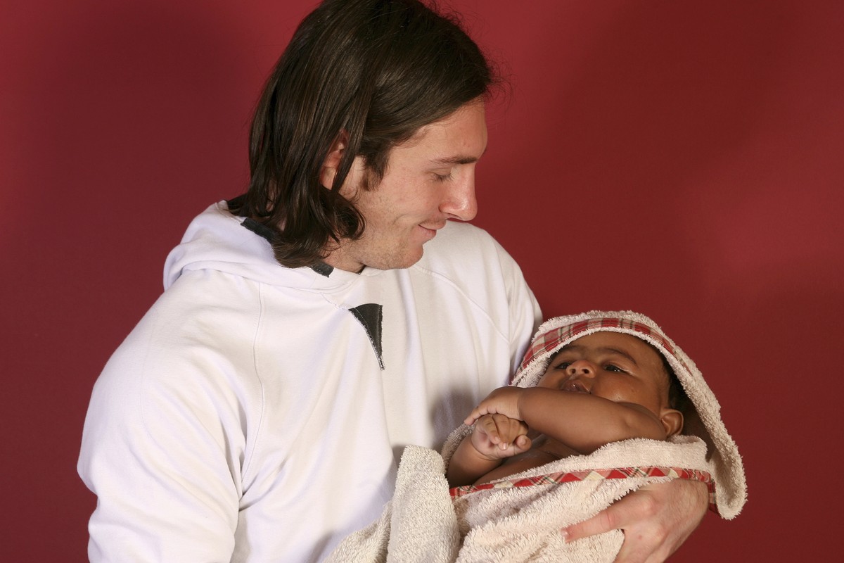 This photo taken in Sept. 2007 shows a 20-year-old Lionel Messi, who had embarked on his legendary Barcelona career just over four years prior, cradling Lamine Yamal, who was merely six months old at  ...