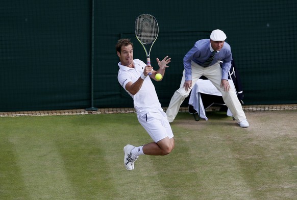 Richard Gasquet of France hits a shot during his match against Stan Wawrinka of Switzerland at the Wimbledon Tennis Championships in London, July 8, 2015. REUTERS/Stefan Wermuth