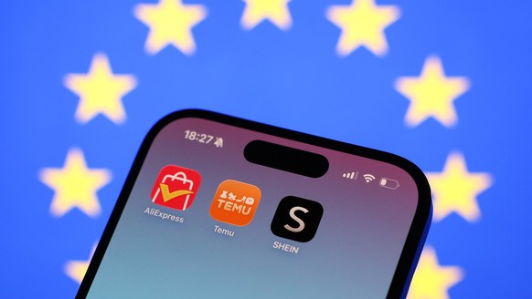 Chinese Online Stores Photo Illustrations European Union flag displayed on a screen and AliExpress, Temu and Shein icons displayed on a phone screen are seen in this illustration photo taken in Krakow ...