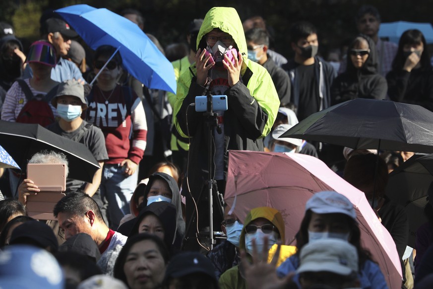 A protester wears a gas mask during a rally for students and elderly pro-democracy demonstrators in Hong Kong, Saturday, Nov. 30, 2019. Hundreds of Hong Kong pro-democracy activists rallied Friday out ...