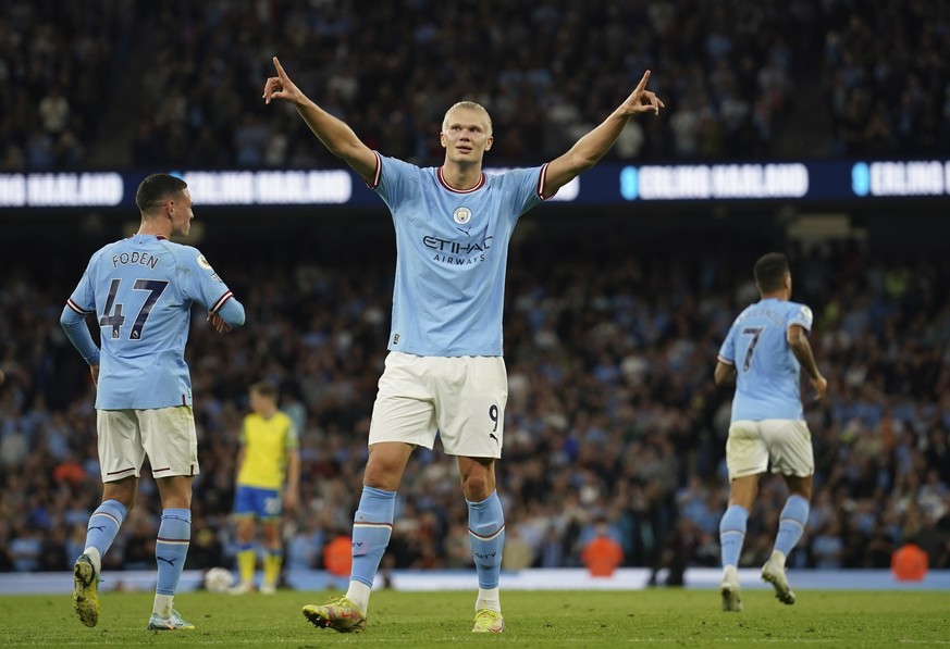 Manchester City's Erling Haaland, centre, celebrates after scoring his side's third goal during the English Premier League soccer match between Manchester City and Nottingham Forest at Etihad Stadium  ...