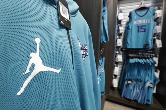 File - In this Oct. 17, 2017 file photo, The Michael Jordan &quot;Jumpman&quot; logo is shown on merchandise at the Charlotte Hornets&#039; NBA basketball fan store in Charlotte, N.C. A federal appeal ...