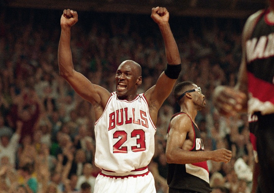 FILE - In this June 14, 1992, file photo, Michael Jordan celebrates the Bulls win over the Portland Trail Blazers in the NBA Finals in Chicago. Decades after Jordan's groundbreaking departure fro ...