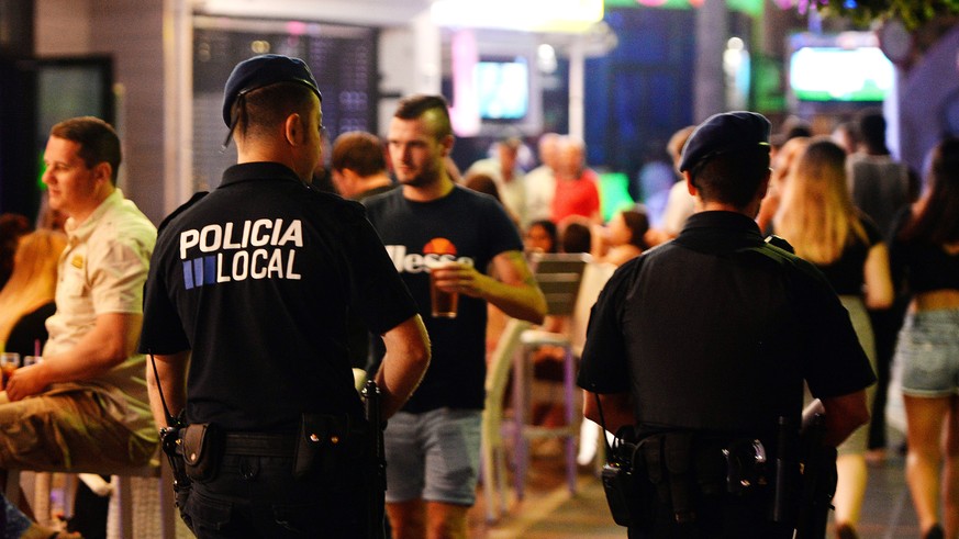 Police officers patrol the resort of Magaluf, in Calvia town, on the Spanish Balearic island of Mallorca, Wednesday, June 10, 2015. Magaluf, the super popular Spanish resort notorious for the alcohol  ...