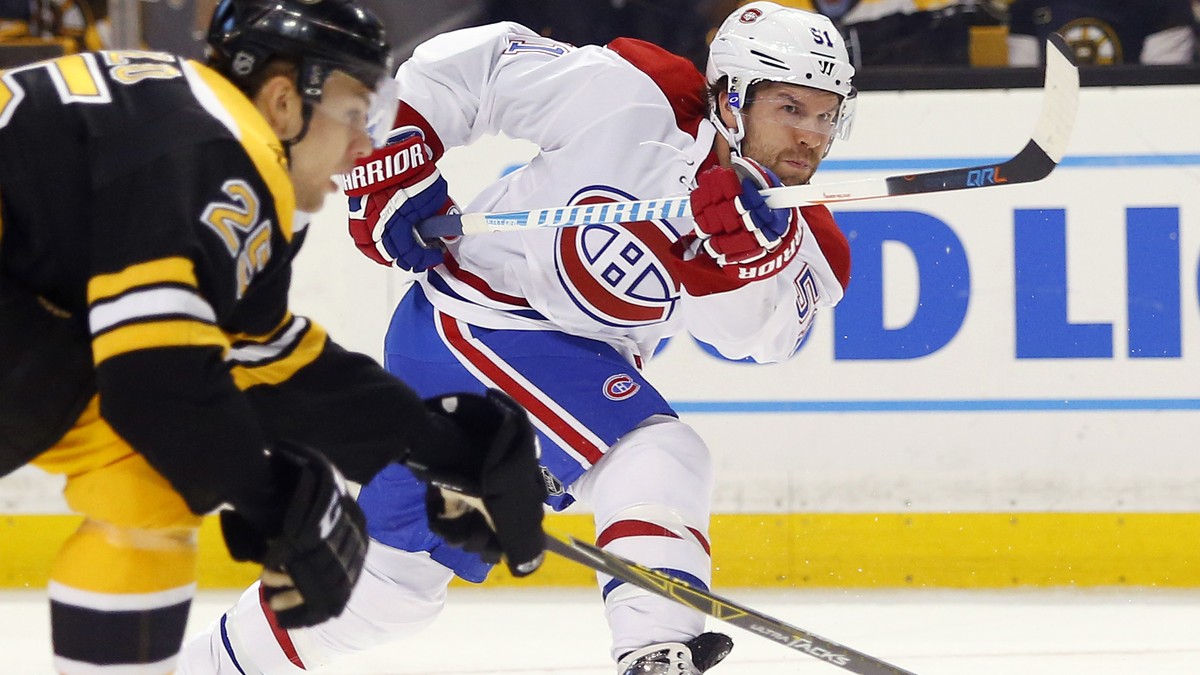 FILE - In this Oct. 22, 2016, file photo, Montreal Canadiens' David Desharnais follows through on a shot during the first period of an NHL hockey game against the Boston Bruins, in Boston. The Ne ...