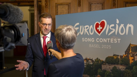 Conradin Cramer, President of the Government of Basel-Stadt, left, attends a press conference on the staging of the ESC 2025, in Basel, on Friday, August 30, 2024. The ESC 2025 will be held in Basel.  ...
