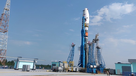 epa10790568 A handout photo made available by the Roscosmos State Space Corporation shows the Soyuz-2.1b rocket with the moon lander Luna-25 (Moon) automatic station being erected at its launch pad at ...