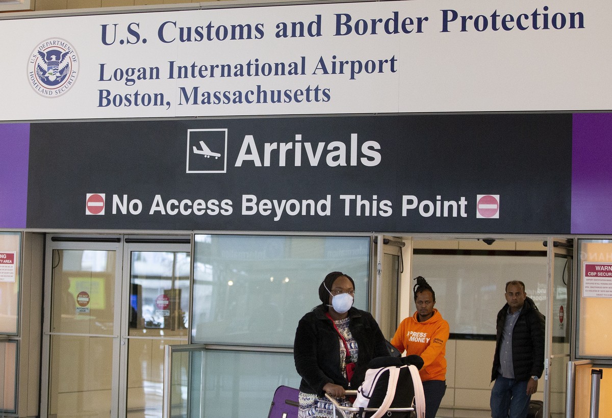 epa08290213 Passengers pass through the US Customs and Border Protection doorways on their arrival to Boston?ïs Logan International Airport, in Boston, Massachusetts, USA 12 March 2020. US President D ...
