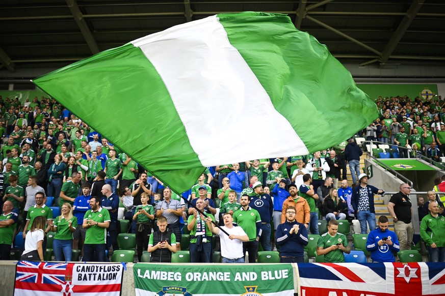 Fans of Northern Ireland during the 2022 FIFA World Cup European Qualifying Group C soccer match between Northern Ireland and Switzerland at Windsor Park stadium in Belfast, Northern Ireland, on Wedne ...