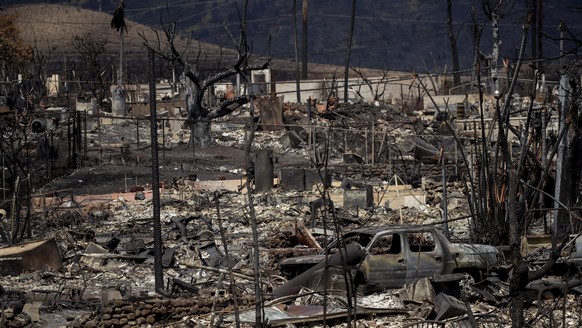 epa10802245 Burned out cars and houses are all that remains after a wildfire swept through a neighborhood in Lahaina, Hawaii, USA, 15 August 2023. At least 99 people were killed in the Lahaina wildfir ...