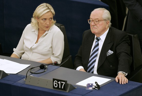 FILE - In this July 14, 2009 file photo Jean-Marie Le Pen, right, and his daughter Marine Le Pen sit at the European Parliament, in Strasbourg, eastern France. Money, and how to get it, has dogged Fre ...