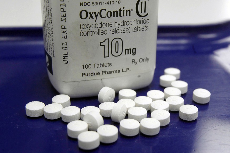 FILE - This Feb. 19, 2013, file photo shows OxyContin pills arranged for a photo at a pharmacy, in Montpelier, Vt. Five state attorneys general announced lawsuits Thursday, May 16, 2019, seeking to ho ...