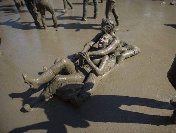 Festivalvisitors dancing in the mud during the OpenAir St. Gallen on Sunday, June 30, 2013, in St. Gallen. The OpenAir St.Gallen is one of the oldest outdoor festivals in Switzerland. It&#039;s close  ...