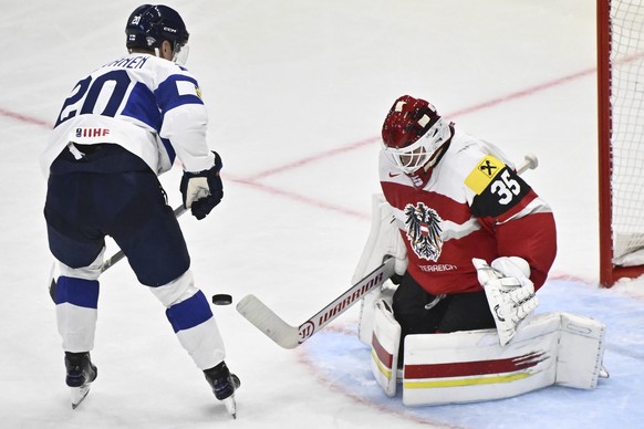 Austria&#039;s goalkeeper Atte Tolvanen, right, stops Finland&#039;s Eeli Tolvanen during a Group A match between Austria and Finland at the hockey world championships, Friday, May 9, 2025, at Avicii  ...