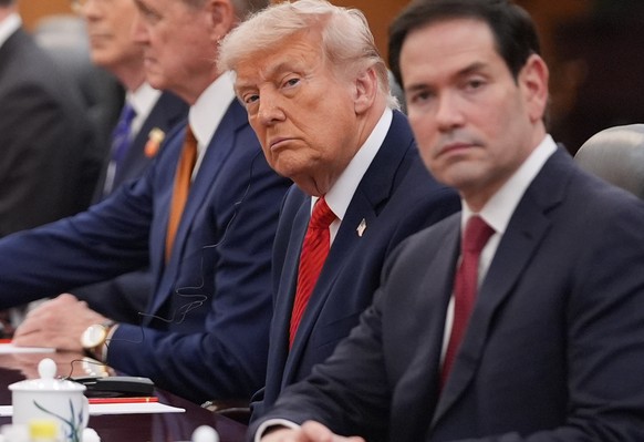 President Donald Trump meets with China's President Xi Jinping at the Great Hall of the People, Thursday, May 14, 2026, in Beijing, as Secretary of State Marco Rubio watches. (AP Photo/Mark Schie ...