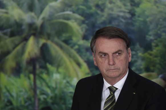 FILE - In this Oct. 1, 2019 file photo, President Jair Bolsonaro attends a ceremony to launch an agro program at the Planalto presidential palace in Brasilia, Brazil. Alter do Chao, a sleepy Amazon to ...