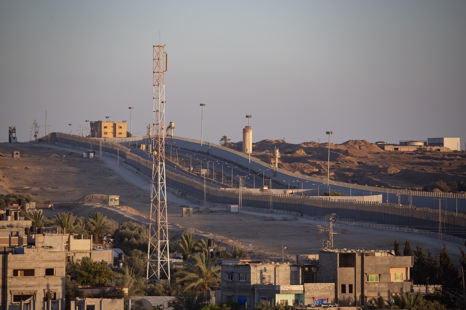 epa11367097 The border fence between the Gaza Strip and Egypt in Rafah, southern Gaza, 24 May 2024. The makeshift camp for internally displaced Palestinians previously located in the area was dismantl ...