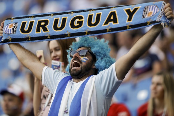 A fan of Uruguay cheers prior to the group A match between Uruguay and Saudi Arabia at the 2018 soccer World Cup in Rostov Arena in Rostov-on-Don, Russia, Wednesday, June 20, 2018. (AP Photo/Andrew Me ...