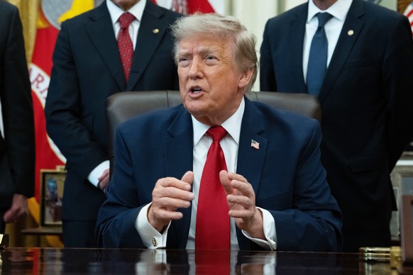 epa13109468 United States President Donald J Trump gives remarks to the press during an executive order signing ceremony for an order that will modify two Utah monuments in the Oval Office of the Whit ...