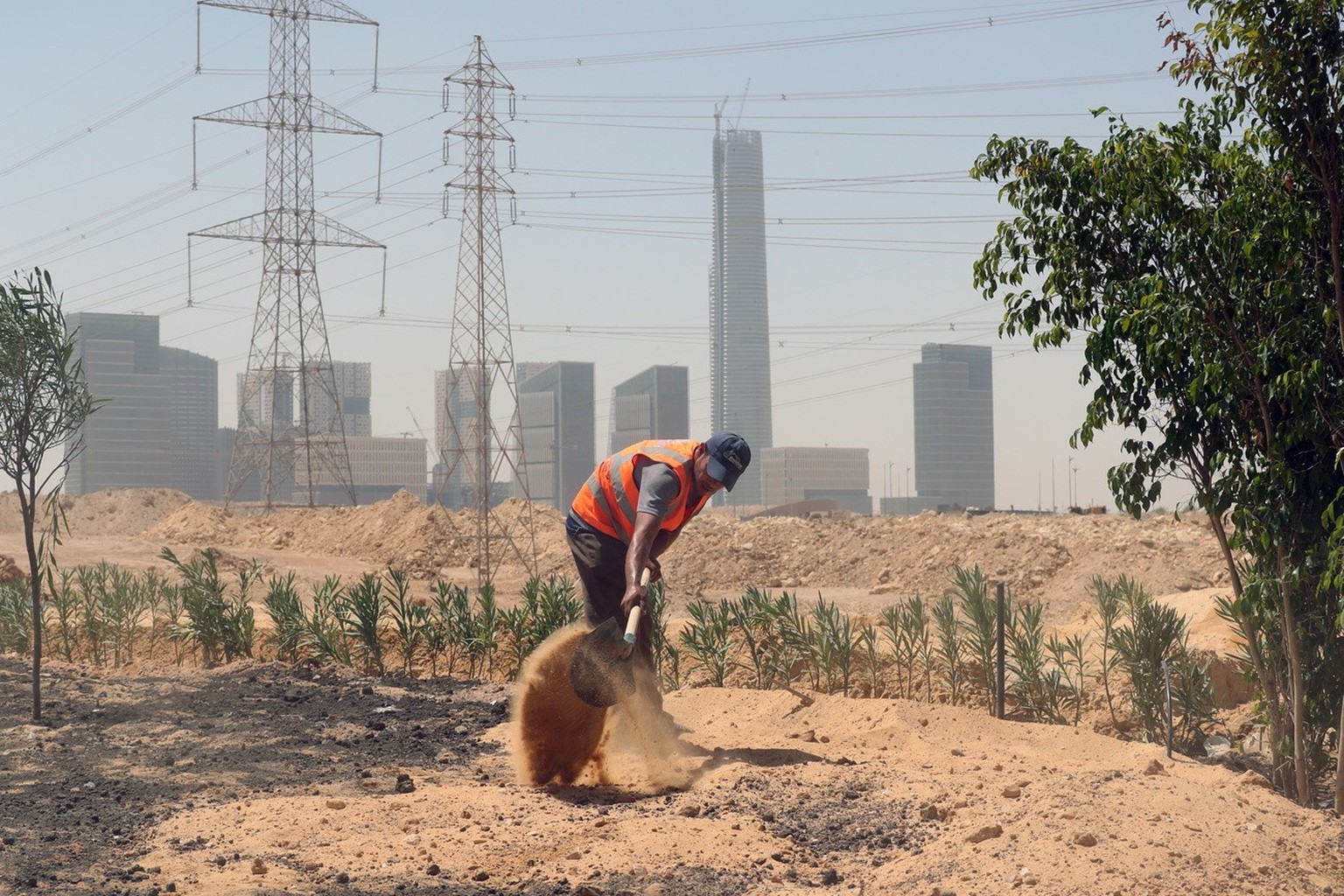 epa10180140 Workers at a construction site of the New Administrative Capital (NAC), some 45 km east of Cairo, Egypt, September 12, 2022. The new city is located 45 kilometers east of Cairo, in an area h...