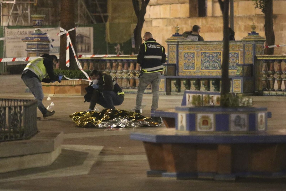 Police work next to the body of a man killed in Algeciras, southern Spain, Wednesday, Jan. 25, 2023. Spain's interior ministry says that one person has been killed and another serious injured in  ...