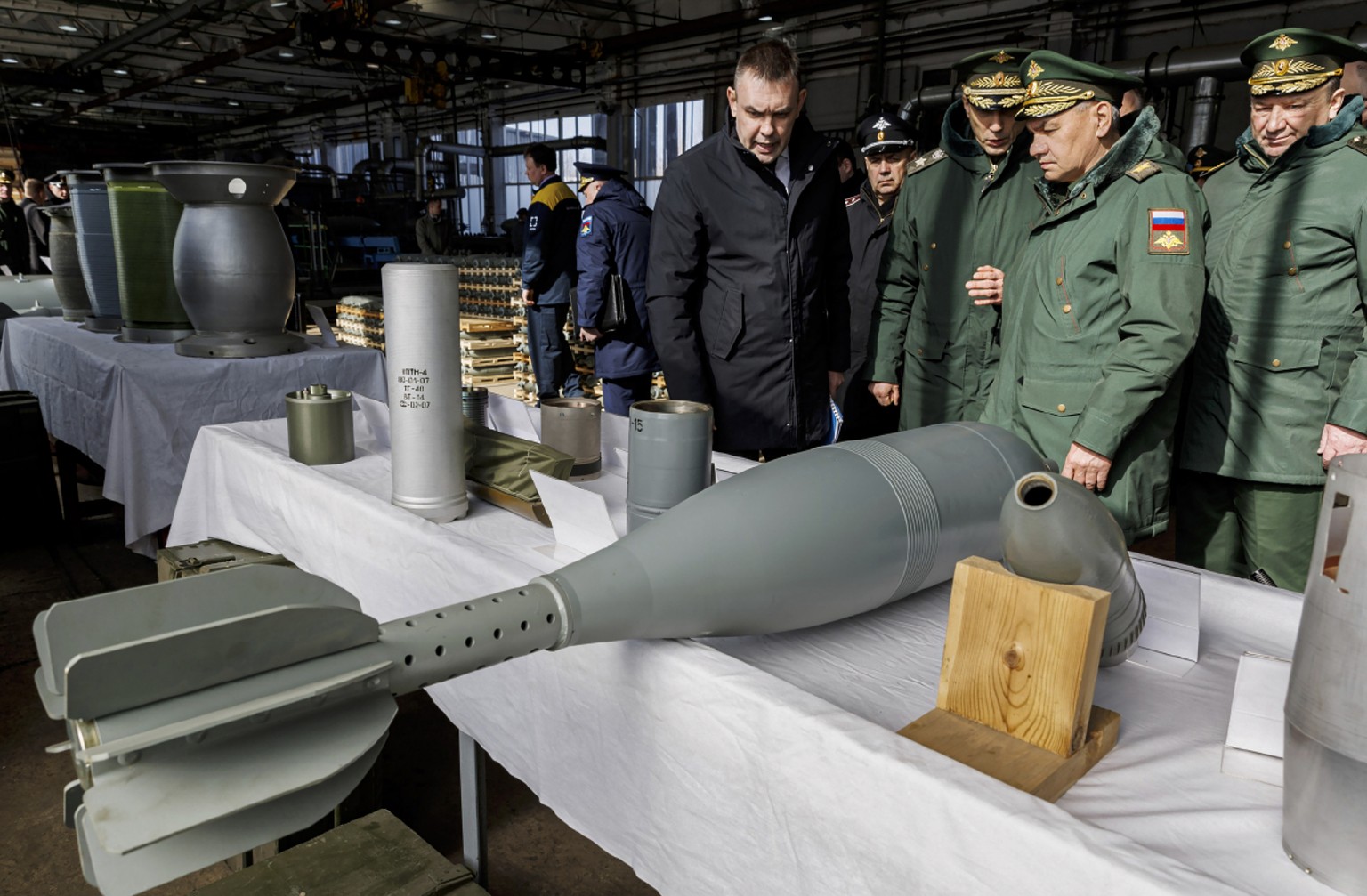 epa11233918 A handout photo made available by the Russian Defence Ministry Press-Service shows Russian Defense Minister Sergei Shoigu (2-R) inspecting the implementation of the state defense order by  ...