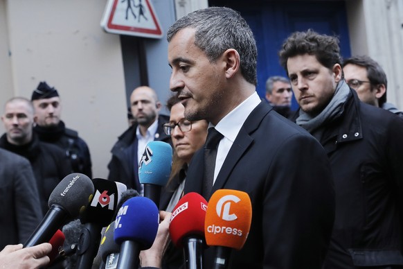 epa10377198 French Interior Minister Gerald Darmanin visits the scene of the shooting at the rue d&#039;Enghien near a Kurdish cultural center in Paris, France, 23 December 2022. The Paris Police Pref ...
