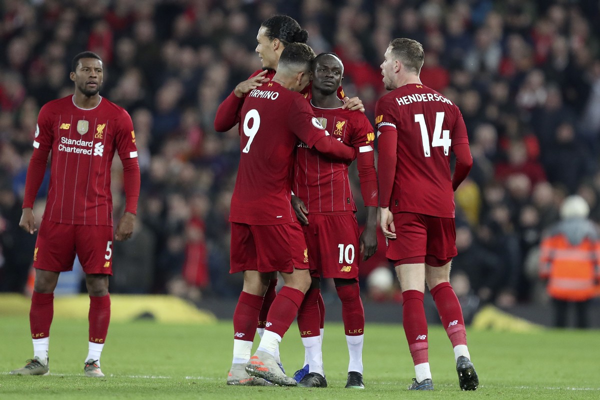 Liverpool's Sadio Mane, 2nd right, celebrates after scoring the opening goal during the English Premier League soccer match between Liverpool and Wolverhampton Wanderers at Anfield Stadium, Liver ...