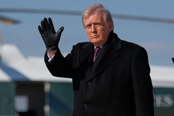 President Donald Trump waves after arriving on Air Force One, Wednesday, March 18, 2026, at Joint Base Andrews, Md., after attending the casualty return at Dover Air Force Base, Del., for the six crew ...