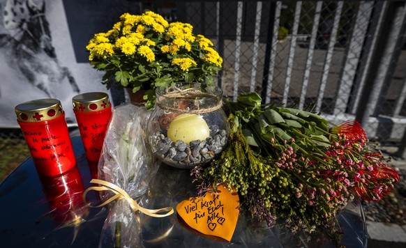 epa13204153 Flowers, candles, and a handwritten note reading 'Stay strong, everyone' are placed outside the entrance to the Schachen horse racing track in Aarau, Switzerland, 01 September 20 ...