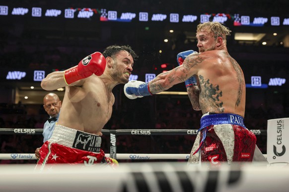 Julio Cesar Chavez Jr., left, throws a punch at Jake Paul during their cruiserweight boxing match on Saturday, June 28, 2025, in Anaheim, Calif. (AP Photo/Etienne Laurent)
Paul Chavez Jr Boxing