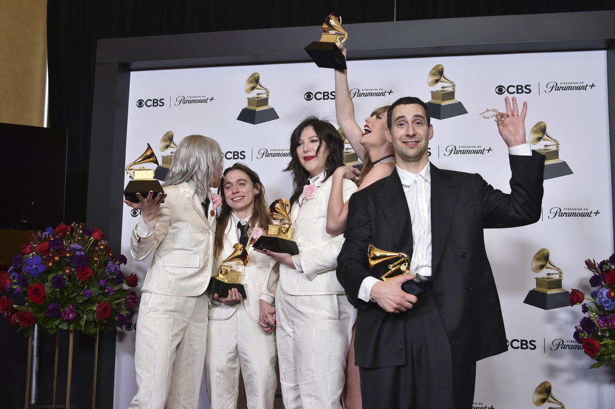 Phoebe Bridgers, from left, Julien Baker, and Lucy Dacus of boygenius pose in the press room with the awards for best rock performance and best rock song for "Not Strong Enough," and best al ...