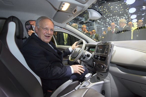 CAPTION CORRECTION - Swiss federal Councillor Johann Schneider-Ammann sits in a Renault ZOE, during the opening of the 87th Geneva International Motor Show in Geneva, Switzerland, Thursday, March 09,  ...