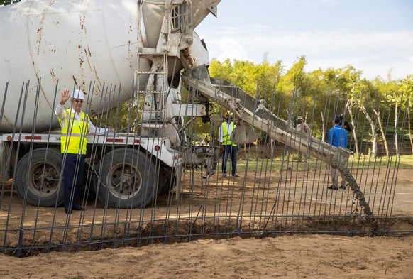 epa09774948 Dominican Republic President, Luis Abinader (L), inaugurates the works of the new border fence that will separate the Dominican Republic and Haiti, at the border crossing located in Dajabo ...