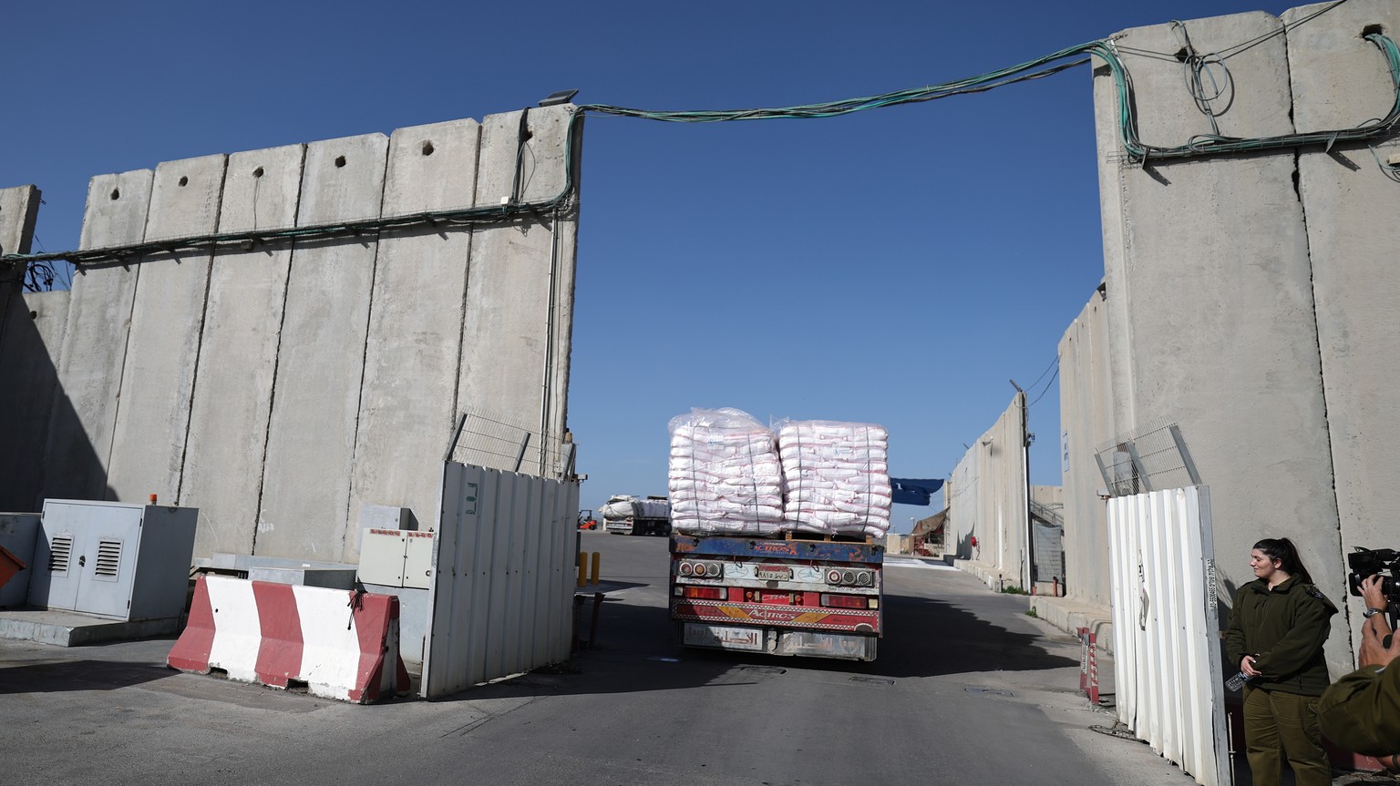 epa11067473 Egyptians trucks carrying humanitarian aid ter the Gaza Strip after undergoing security checks at the Kerem Shalom Crossing, 10 January 2024. Since 07 October, up to 1.9 million people, or ...