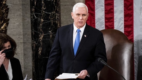 FILE – Vice President Mike Pence acts as a joint session of the House and Senate to confirm Electoral College votes cast in the November election, at the Capitol in Washington, Wednesday…