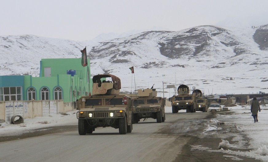 epa08170109 Afghan soldiers prepare to reach the scene of a plane crash near Ghazni, Afghanistan, 27 January 2020. According to reports a place crashed in Deh Yak district of Ghazni province where the ...