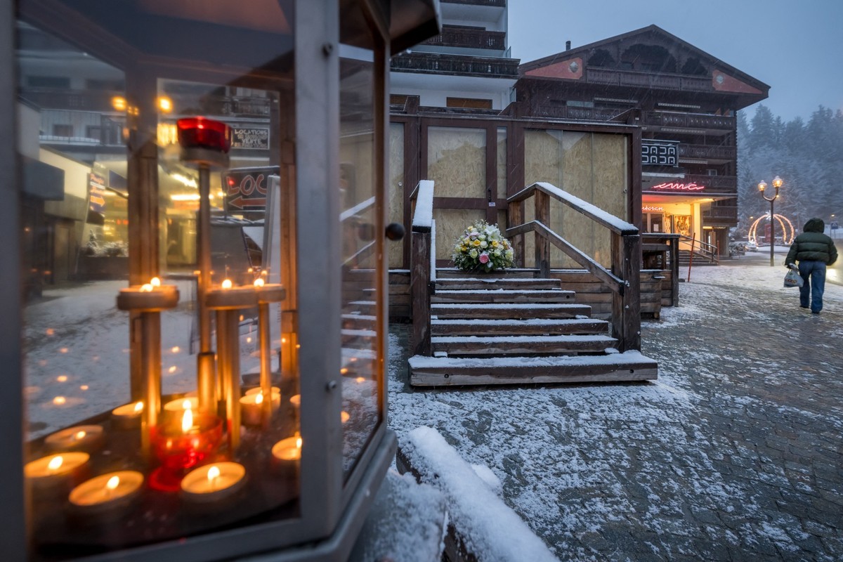 This photograph shows a bouquet of flowers left by members of the Italy's alpine ski team, which takes part in the World Cup races in Crans-Montana, at the entrance of the bar Le Constellation in ...