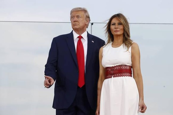 President Donald Trump and first lady Melania Trump stand onstage during a &quot;Salute to America&quot; event on the South Lawn of the White House, Saturday, July 4, 2020, in Washington. (AP Photo/Pa ...