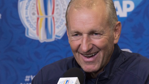 Team Europe head coach Ralph Krueger smiles as he responds to reporters questions at a news conference after the first practice session in preparation for the World Cup of Hockey tournament, Monday, S ...