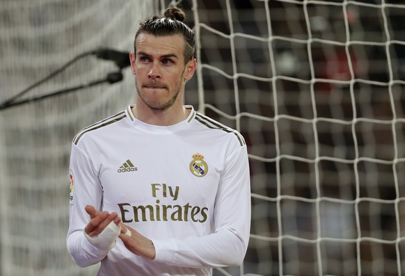 Real Madrid&#039;s Gareth Bale leaves the game during the Spanish La Liga soccer match between Real Madrid and Celta de Vigo at the Santiago Bernabeu stadium in Madrid, Spain, Sunday, Feb. 16, 2020. ( ...