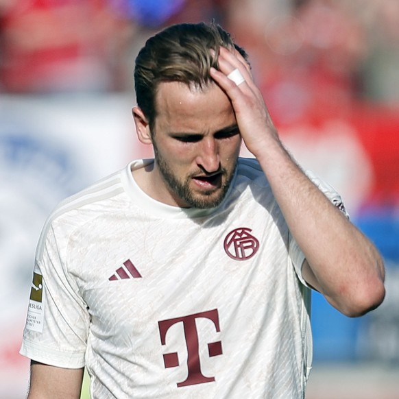 epa11262532 Munich&#039;s Harry Kane reacts after losing the German Bundesliga soccer match between 1. FC Heidenheim and FC Bayern Munich in Heidenheim, Germany, 06 April 2024. EPA/RONALD WITTEK CONDI ...