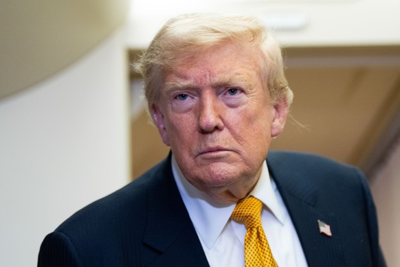 President Donald Trump speaks with reporters in flight on Air Force One after landing at U.S. Air Force Base at RAF Mildenhall, in Suffolk Eastern England, Wednesday, July 8, 2026. (AP Photo/Alex Bran ...