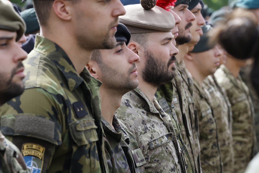 epa13028059 Servicemen of the NATO Multinational Brigade attend the change of the NATO Multinational Brigade command ceremony at Adazi Military Base, Latvia, 10 June 2026. During the ceremony, Colonel ...