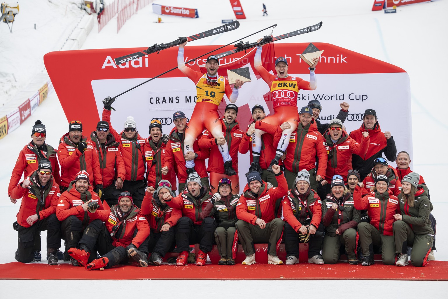 Winner Marco Odermatt, top right, and second placed Alexis Monney, top left, both of Switzerland, are carried by their teammates, from left, Franjo von Allmen, Loic Meillard, Marco Kohler and Justin M ...