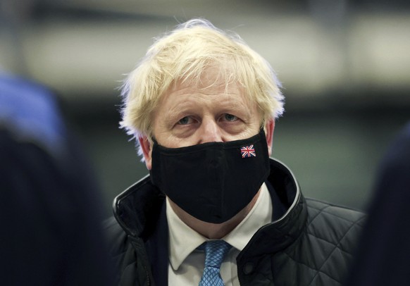 Britain&#039;s Prime Minister Boris Johnson looks on, during a visit to RAF Valley, in Anglesey, North Wales, Thursday, Jan. 27, 2022. (Carl Recine/Pool Photo via AP)