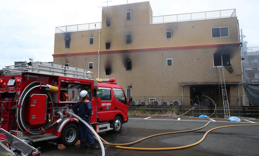 epa07723983 A fire vehicle at a three-story Kyoto Animation building which fire occurred, in Kyoto, western Japan, 18 July 2019. News have reported at least 12 people died and many others injured in a ...